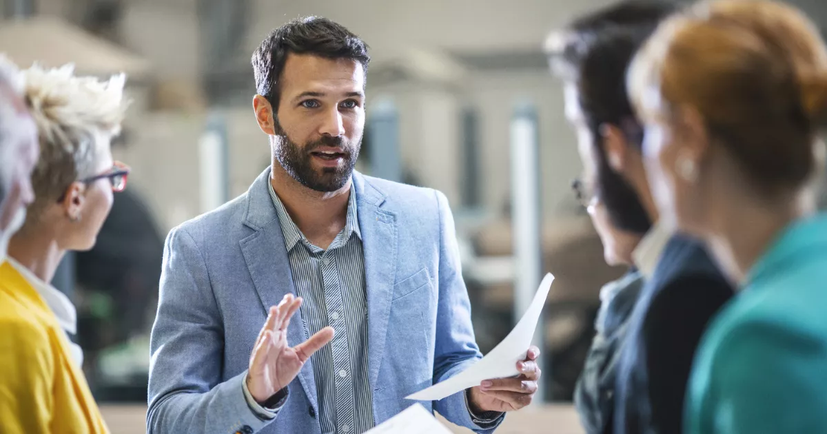 A working professional studying the AIM Mini MBA on a laptop